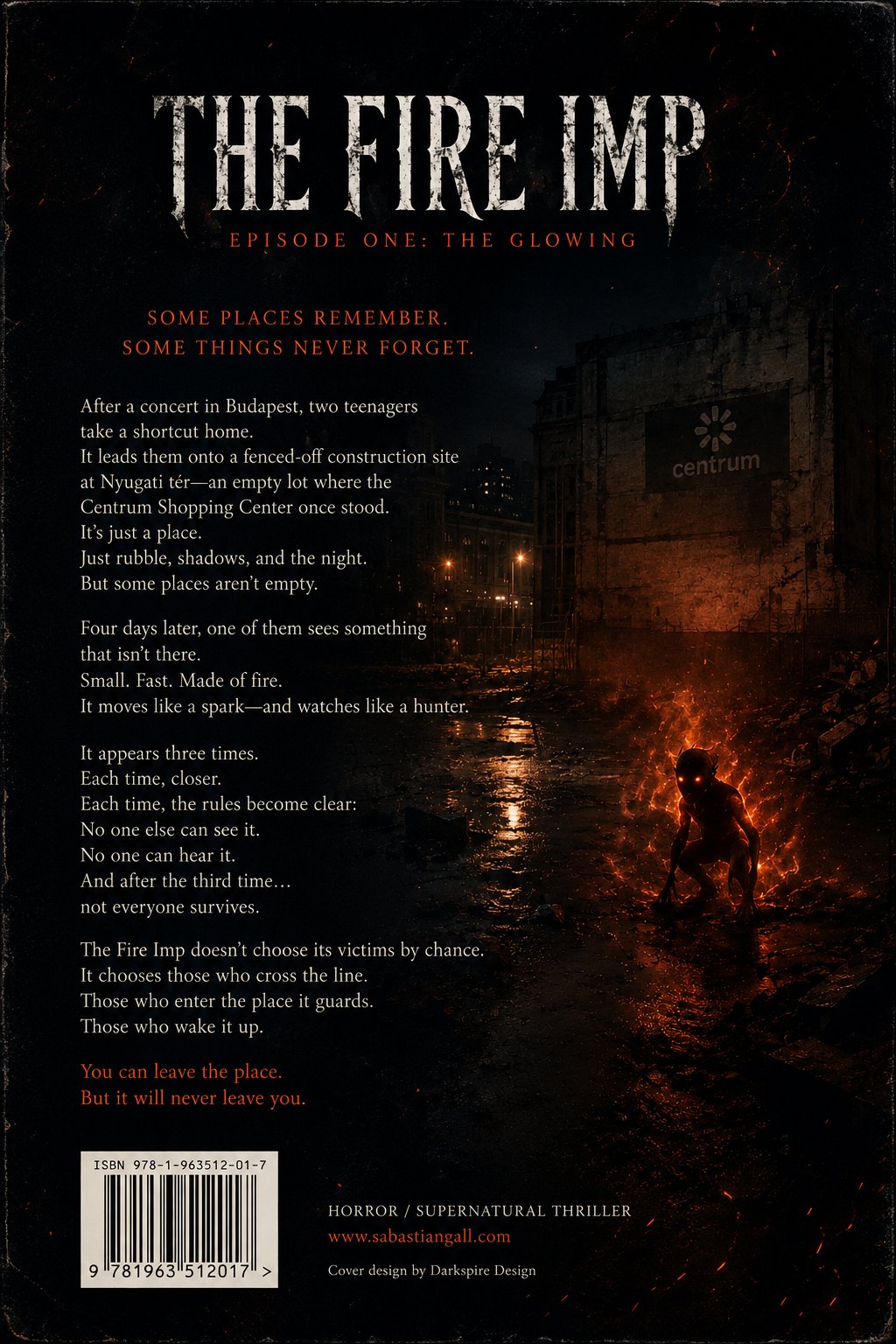 The back cover of The Fire Imp: Episode One – The Glowing features a dark urban ruin at night with fiery orange reflections on rain-soaked ground. A small burning imp-like creature crouches in the lower right corner, glowing against the surrounding darkness. The background shows the abandoned Centrum construction site near Nyugati tér in Budapest, with broken concrete, fencing, and shadowy city lights. White and orange text presents the book synopsis over the left side of the image, creating a cinematic supernatural horror atmosphere.